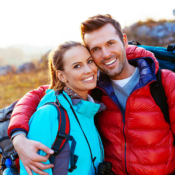 Couple Hugging on a Hiking Trail